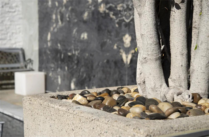 Polished white pebble stones used in a garden pathway 